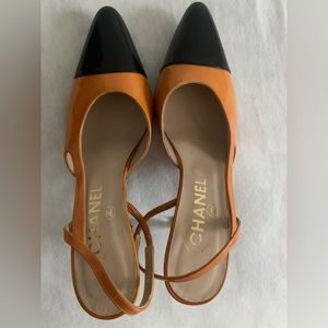 Chanel sling backs low heels.